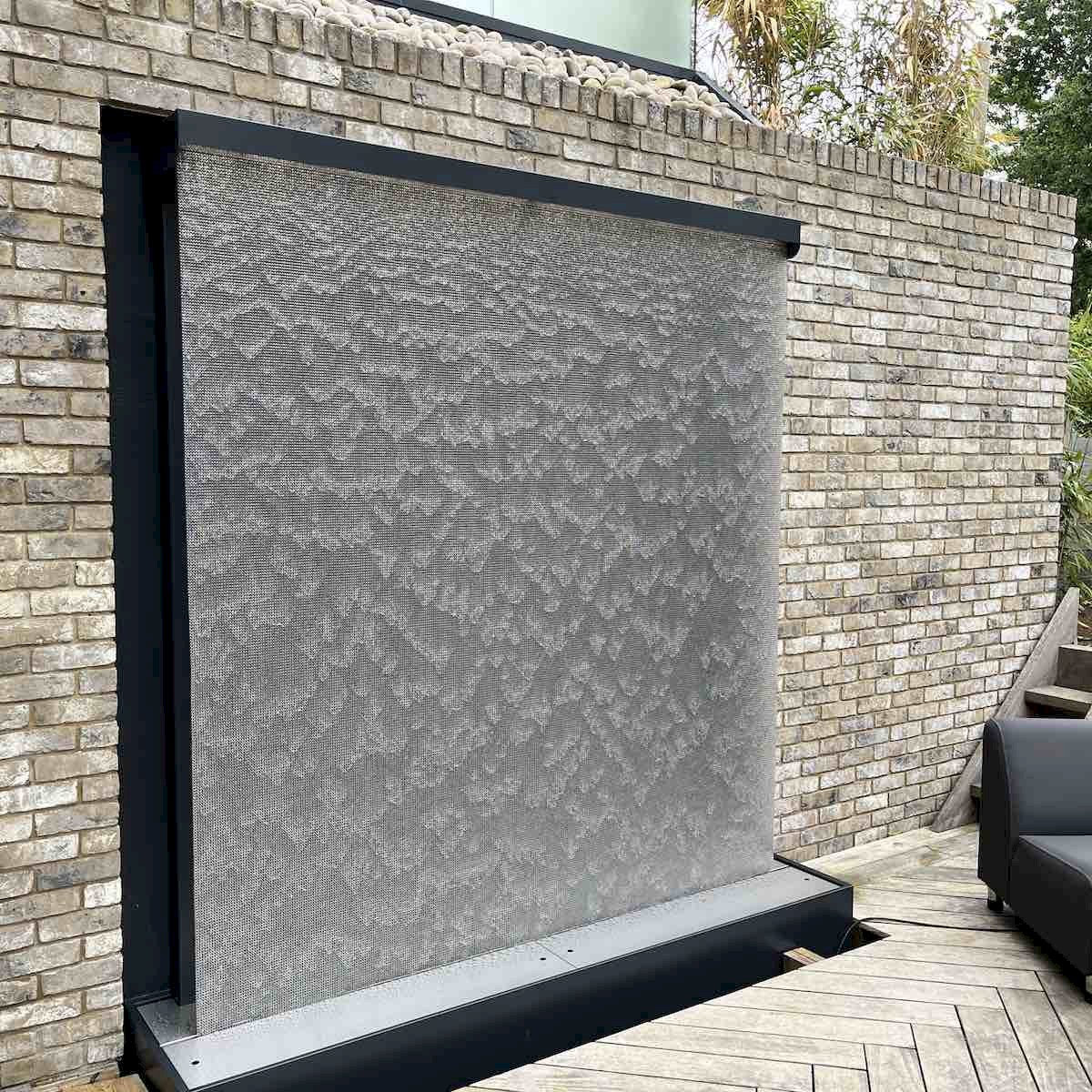 AquaVeil water wall fitted within a recessed brick wall to provide a more integrated appearance.